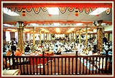 Swamishri performing the mahapuja rituals as part of the murti pratishtha ceremony in the mandir hall   