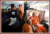 Swamishri engrossed in reading letters of devotees during the flight London to Toronto
