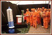 Swamishri walks through the exhibition, 'Pathways to Harmony'