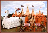 Swamishri in a swan-chariot