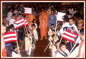 On the evening of Bal Din, children march and lead Swamishri into the assembly