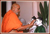 Offering pujan to Shri Radha Krishna Dev