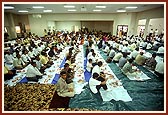 Devotees participating in the Maha puja ceremony during the pratishtha