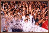 Balaks and kishores dance and rejoice in the shower of divine water. They cry for more and Swamishri blesses them with his abundant grace and joy