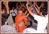 Swamishri joins the dancing kishores during the kirtan bhakti program by sadhus in the shibir