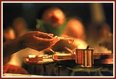 Swamishri engaged in maha-puja of Lord Harikrishna Maharaj