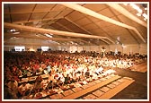 Devotees participating in the maha-puja rituals