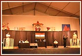 Youths perform a drama 'Gunegar Kaun?' during the evening assembly