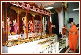 Swamishri performs arti of Thakorji during the Patotsav (mandir inauguration anniversary)