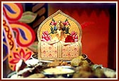 Lord Harikrishna is offered a bowl of dudh-pouwa 