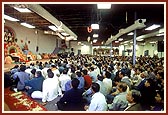 Devotees witness the murti pratishtha ceremony