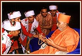 Swamishri blessing some of the performing youths