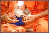 Panchamrut: sanctified ghee, sugar, milk, yogurt, honey poured in the kalash