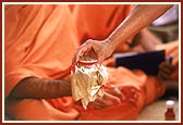 Closing the kalash with cloth and placed in the pit in Agni direction (south-east)