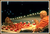 Swamishri humbly engaged in darshan of Lord Harikrishna Maharaj during puja on Diwali day 