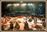 Devotees on stage for the Yagna