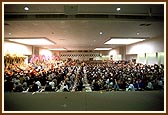 Swamishri joined by devotees in performing the Annakut arti in the Haveli hall   