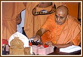 Swamishri performs pujan of bricks and arti during the foundation stone laying ceremony for the new mandir in Detroit.