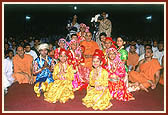 Balaks with Swamishri after performing a folk dance on Children's Day