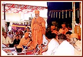 Blesses the the devotees after a maha-puja ritual