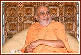 Swamishri in a divine, jovial mood during the Yogi Jayanti celebration in the mandir