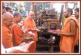 Swamishri offers pujan for a borewell by BAPS for the citizens of Mahelav