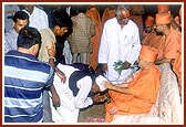 After the assembly Swamishri blesses the local cowherds