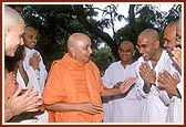 Engaged in a jovial conversation with sadhaks from USAand UK