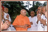 Engaged in a jovial conversation with sadhaks from USA and UK