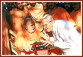 Meets and blesses a senior devotee