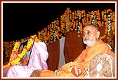 Swamishri on stage during an assembly