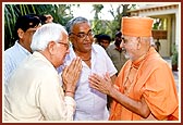 Shri Dhirubhai Nanji Mehta (left) with Swamishri