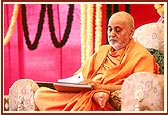 Swamishri engaged in letter-writing during the assembly