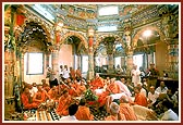 Swamishri is seated beneath the mandir dome