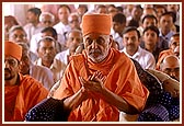 Swamishri, senior sadhus and devotees during the murti pratishtha rituals beneath the mandir dome