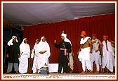 Youths enact the story of Gangaram Mal and have a photo session with Swamishri