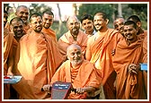 Swamishri happily responds to the youths while returning after darshan of Yogi Smruti Mandir &nbsp;&nbsp;
