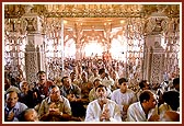 Devotees and participants during the pratishtha beneath the mandir dome