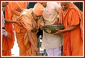 Pouring cement over the nidhi kumbh