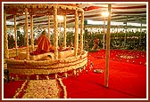 Swamishri performs his morning puja in a decorated 12-facing hindolo