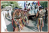 Tribal devotees perform a traditional dance