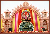 Thakorji on a decorative stage during the giant Mahamantra assembly 