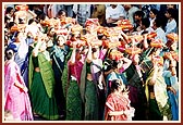 Women devotees chant the Swaminarayan mahamantra and reverentially carry 'mantra pothis' during the rally