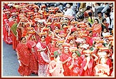 ... women devotees reverentially carry 'mantra pothis' during the rally