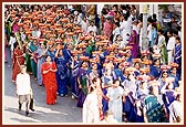 Women devotees chant the Swaminarayan mahamantra and reverentially carry 'mantra pothis' during the rally