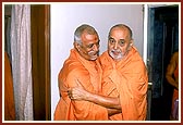 Swamishri embraces Dr. Swami who has returned to India after a 7-month Satsang Tour of UK, Europe, USA and Africa