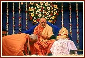 Senior sadhus bow and offer respects to Swamishri on his birthday