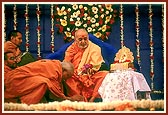 Senior sadhus bow and offer respects to Swamishri on his birthday