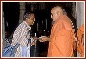 Swamishri blesses a blind devotee