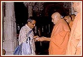 Swamishri blesses a blind devotee